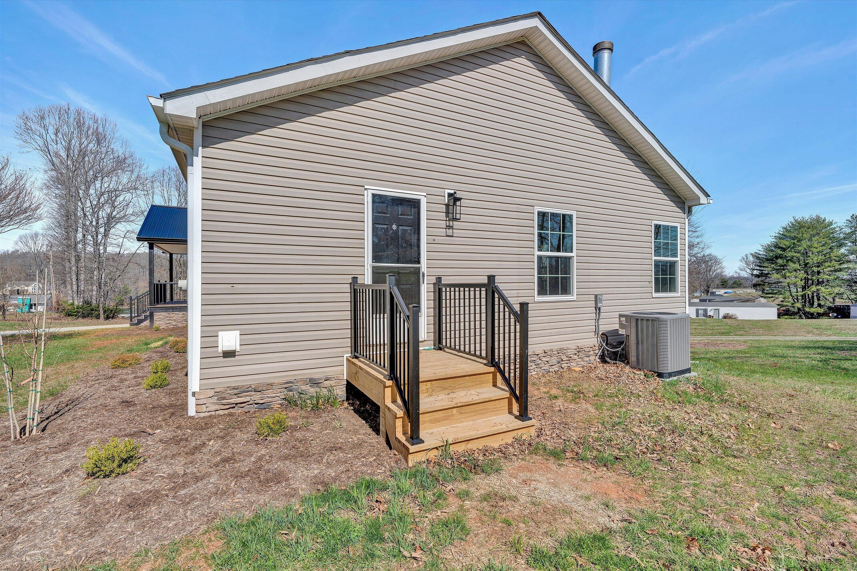200 Surber Drive Moneta, VA 24121 - Photo 42 of 52 a view of backyard of house and wooden deck