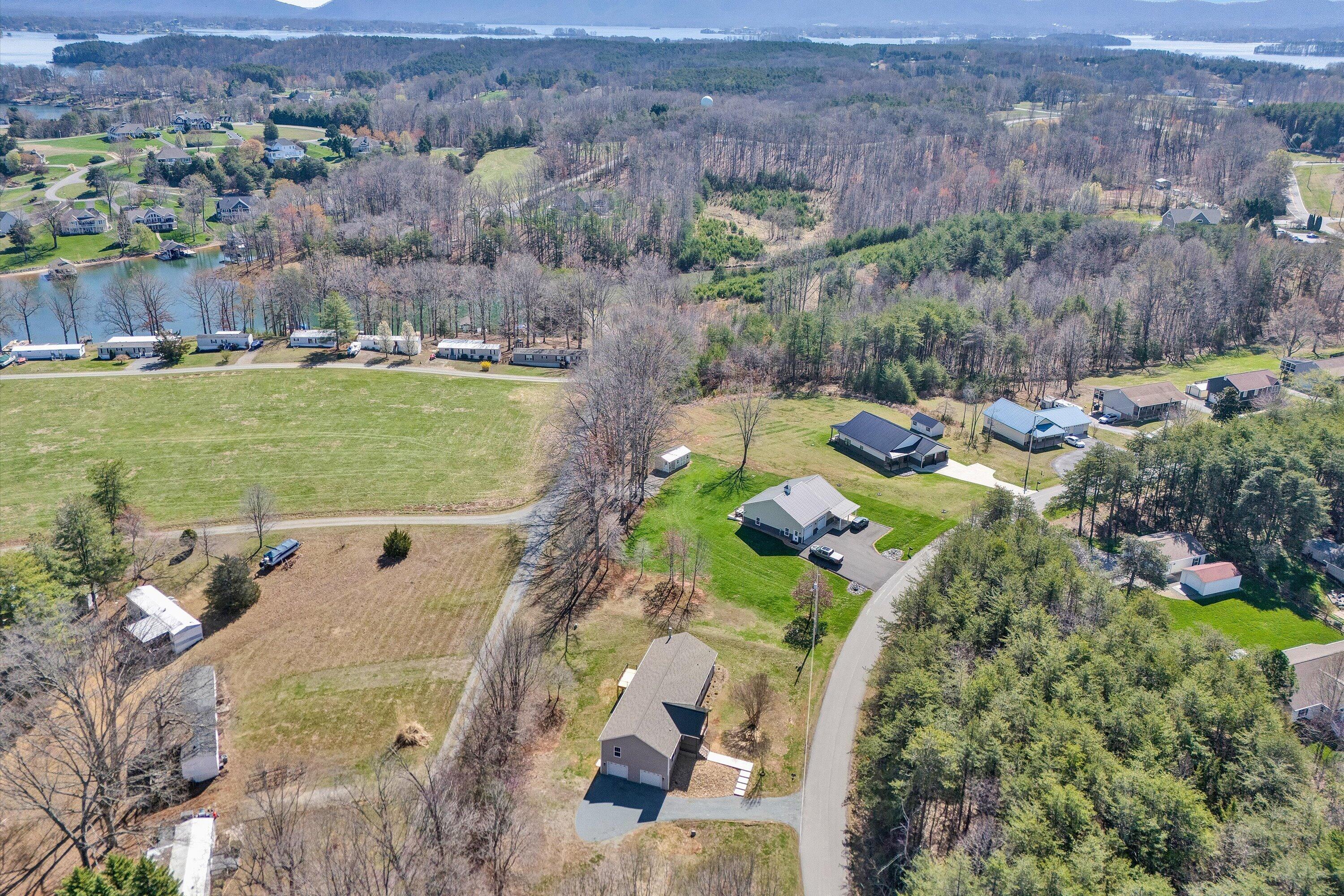 200 Surber Drive Moneta, VA 24121 - Photo 50 of 52 an aerial view of a house with a garden and lake view
