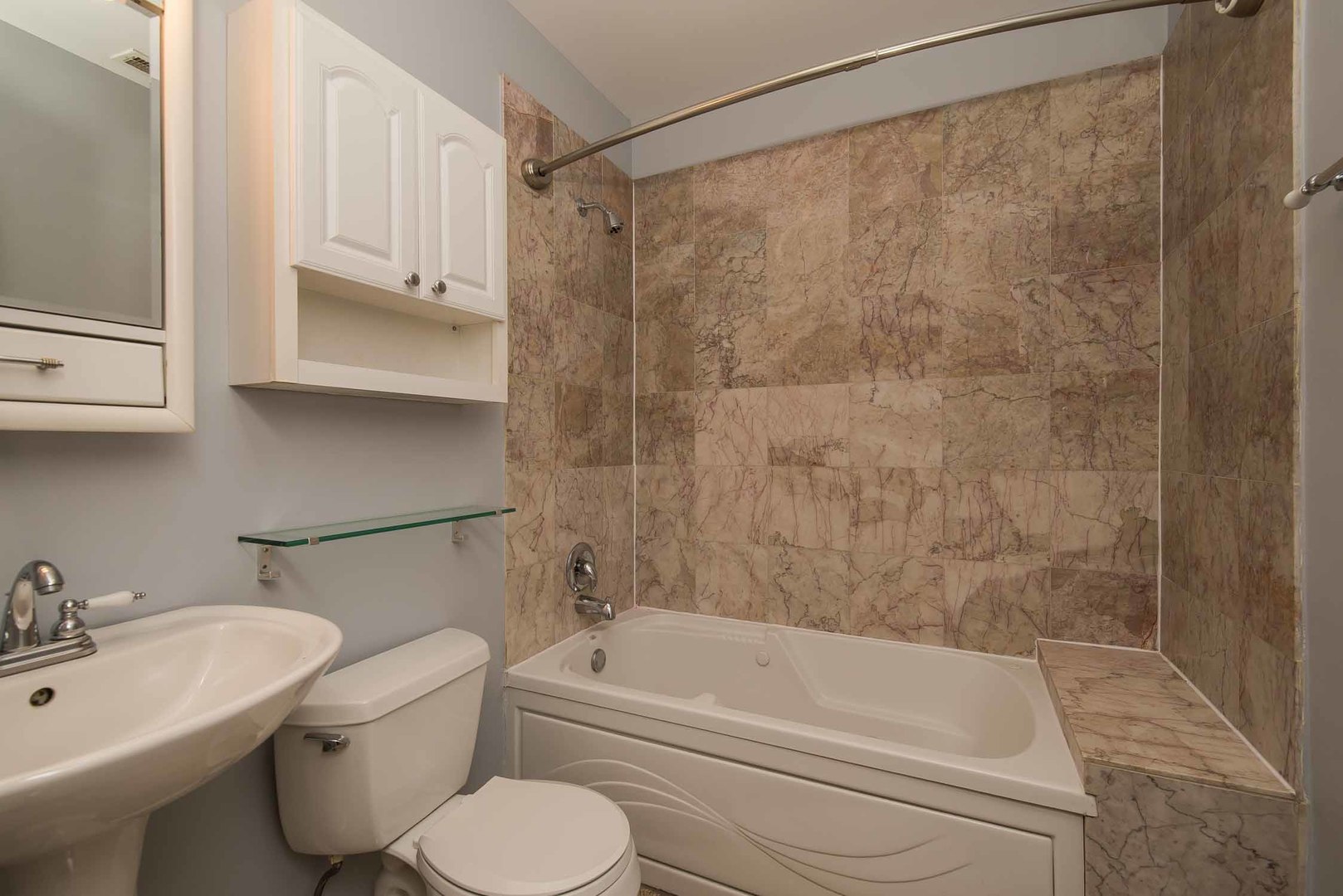 1628 West Juneway Terrace, Unit 2W Chicago, IL 60626 - Photo 18 of 23 a bathroom with a sink toilet and shower