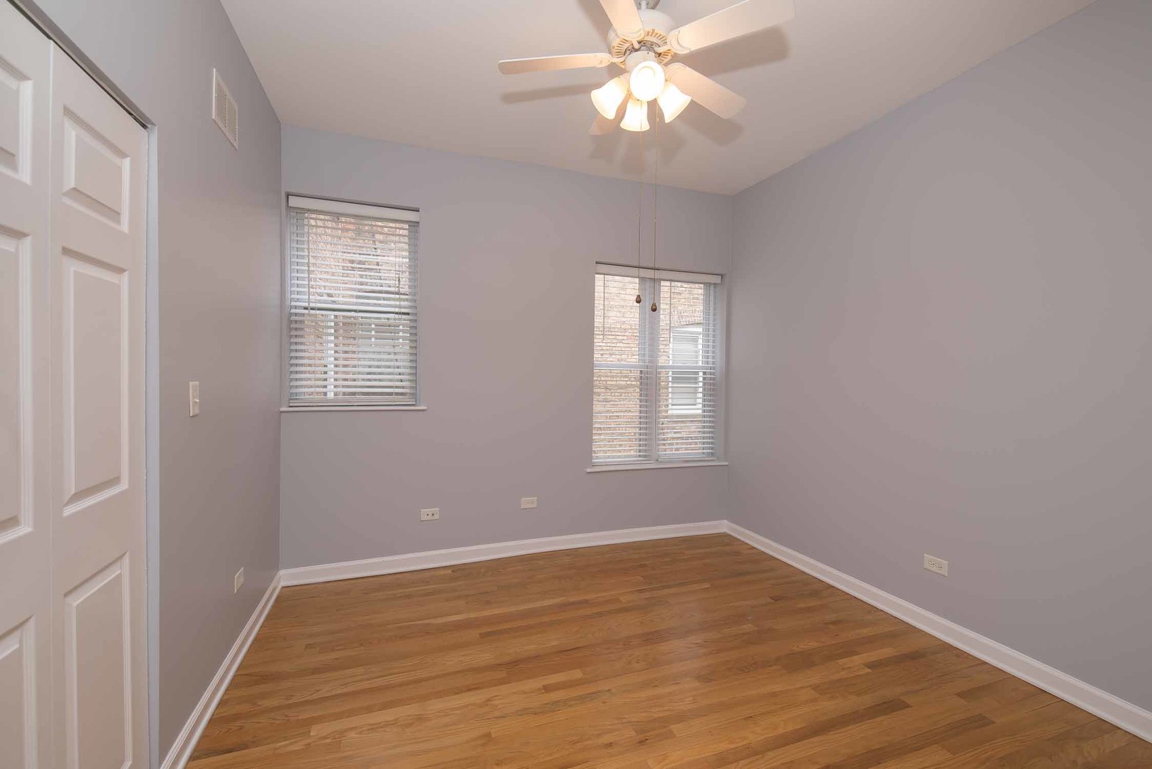 1628 West Juneway Terrace, Unit 2W Chicago, IL 60626 - Photo 19 of 23 a view of an empty room with a window and wooden floor