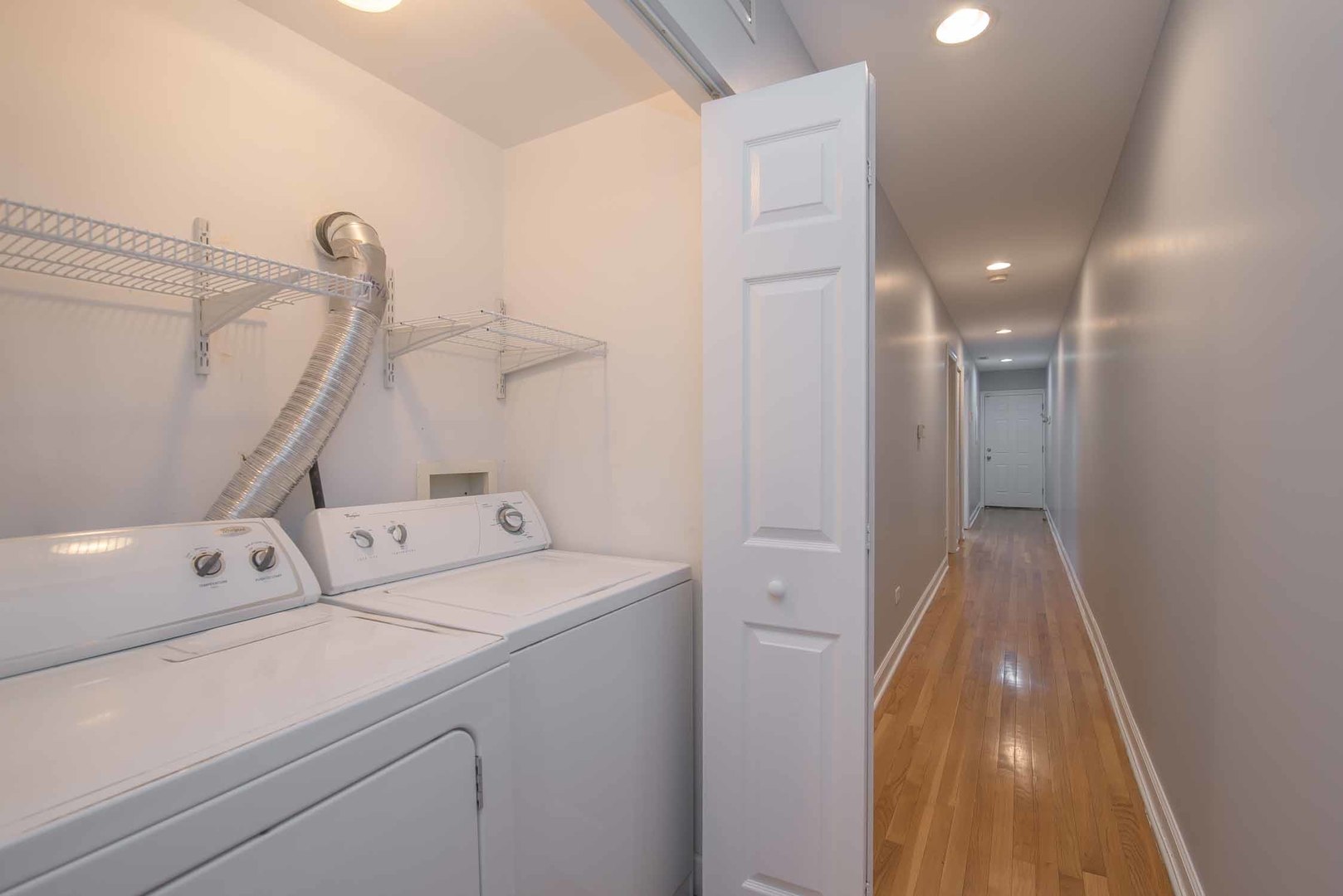 1628 West Juneway Terrace, Unit 2W Chicago, IL 60626 - Photo 22 of 23 a view of storage and utility room with washer and dryer