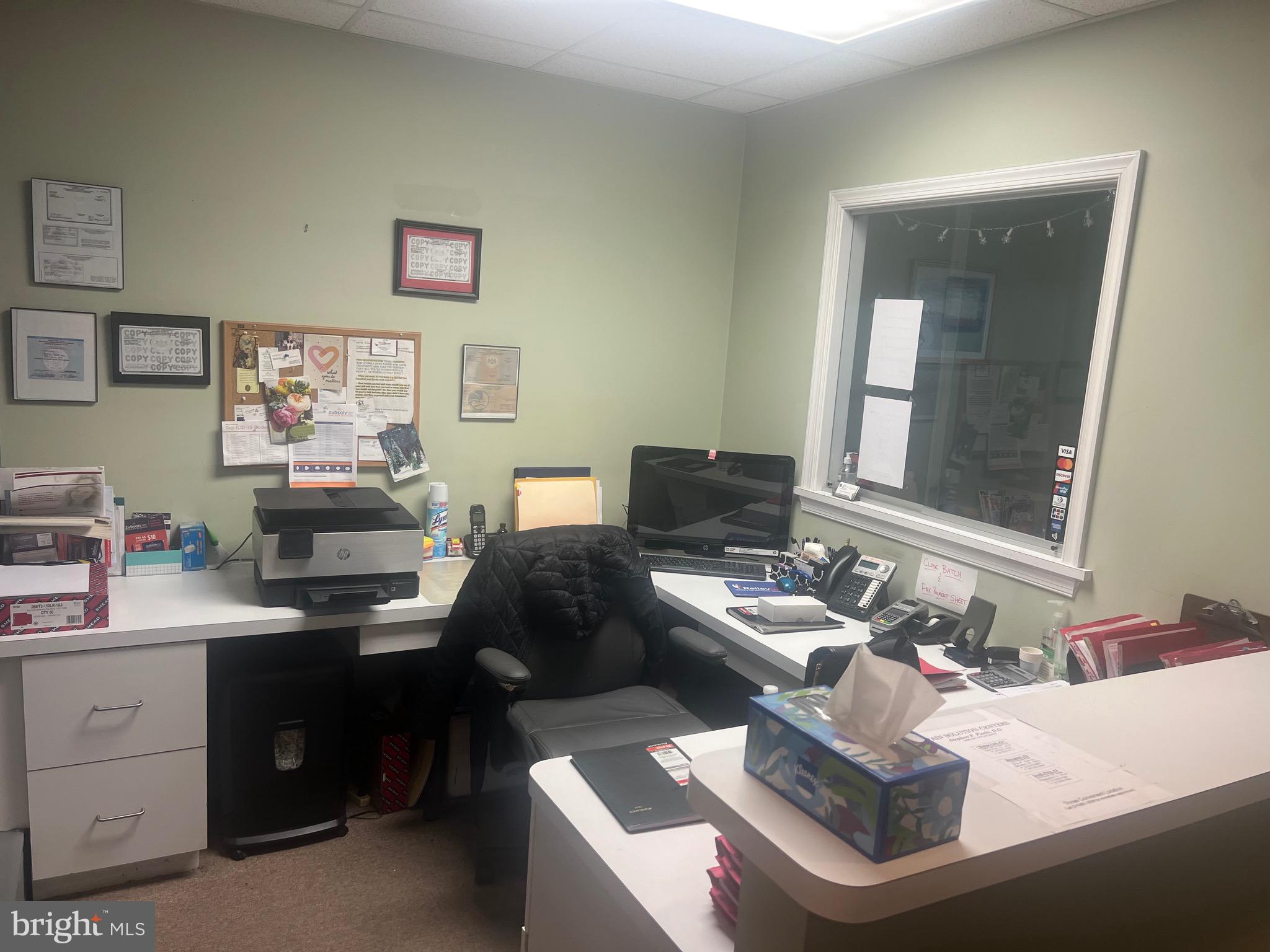 a workspace with furniture and window