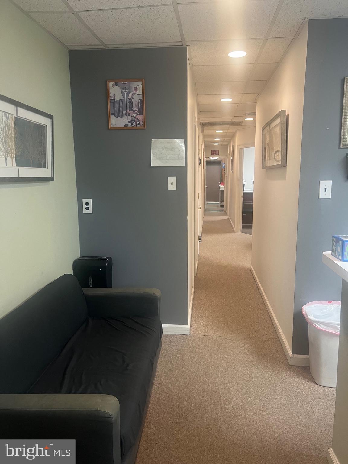 648 East Chester Pike, Unit A Ridley Park, PA 19078 - Photo 2 of 10 a living room with furniture and a toilet