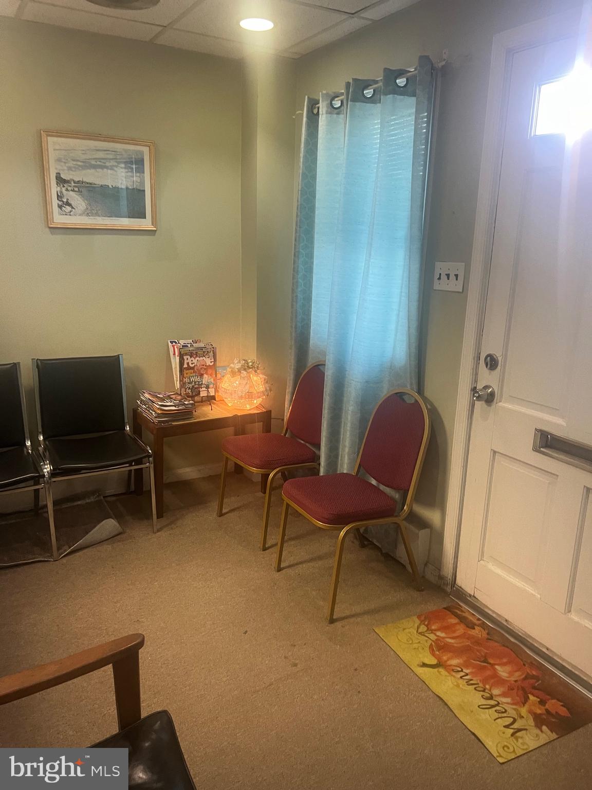 648 East Chester Pike, Unit A Ridley Park, PA 19078 - Photo 4 of 10 a living room with furniture and a flat screen tv