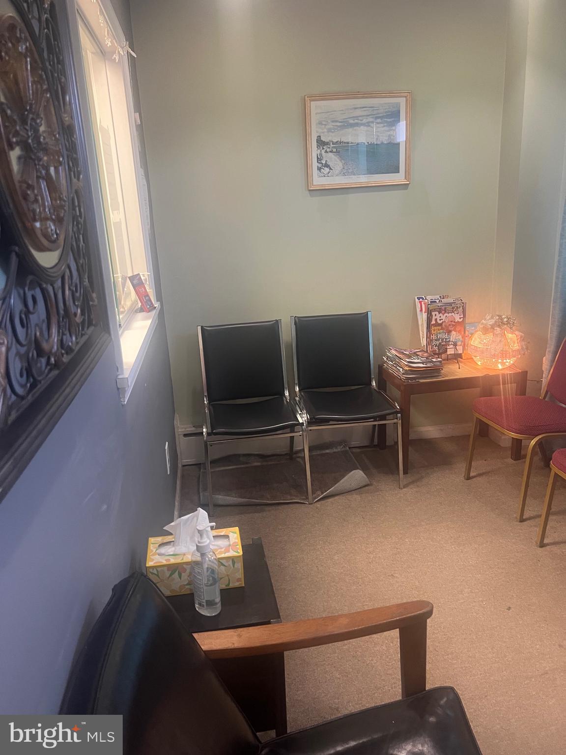 648 East Chester Pike, Unit A Ridley Park, PA 19078 - Photo 5 of 10 a living room with furniture and a window