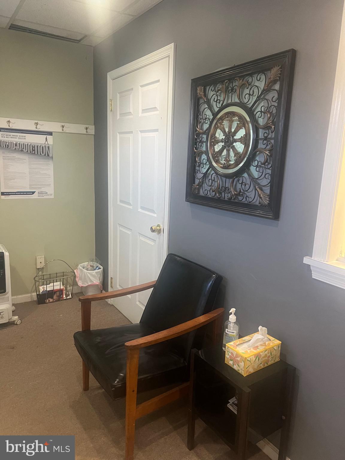 648 East Chester Pike, Unit A Ridley Park, PA 19078 - Photo 8 of 10 a living room with chair and furniture