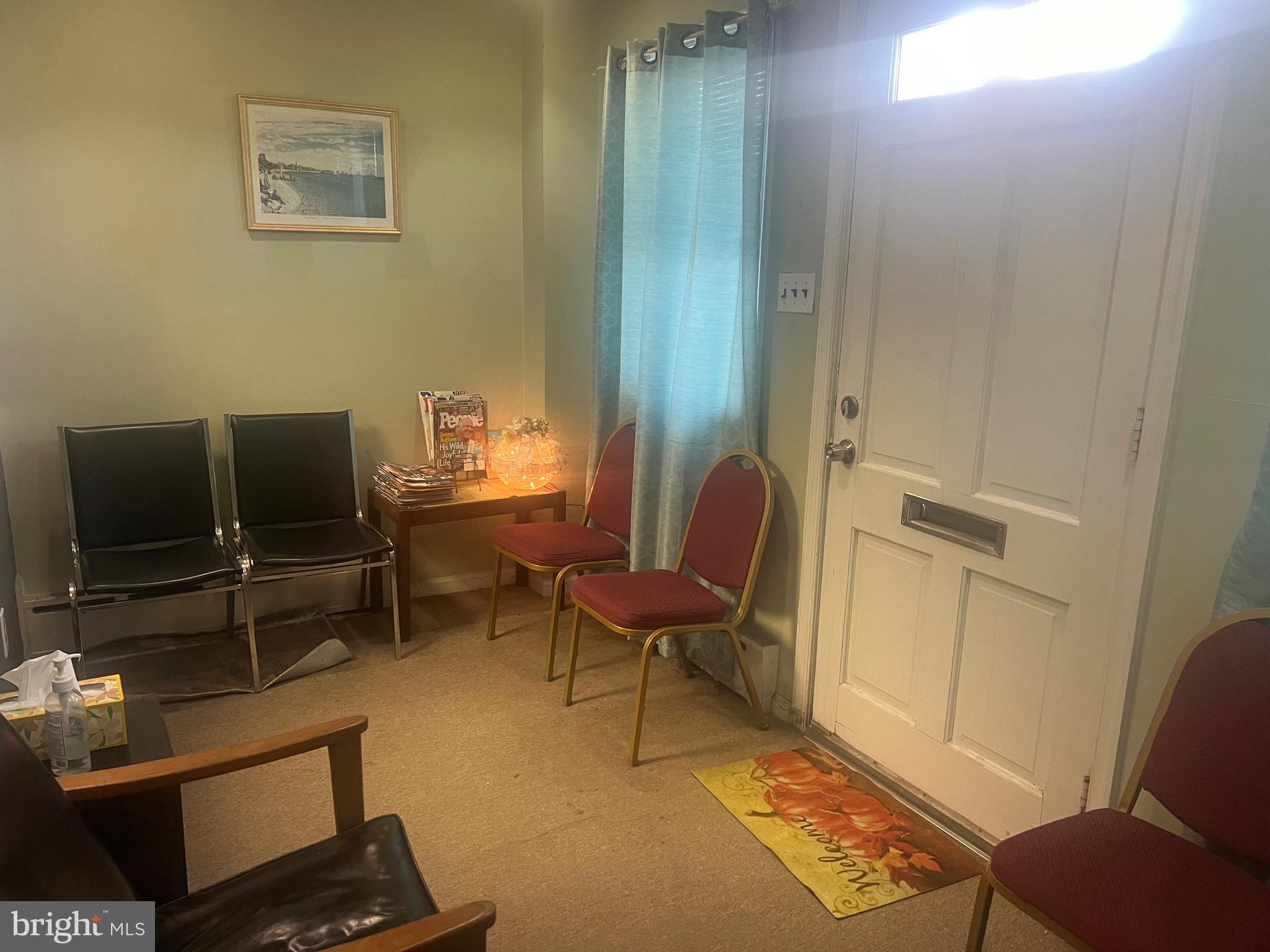 648 East Chester Pike, Unit A Ridley Park, PA 19078 - Photo 10 of 10 a living room with furniture and a window