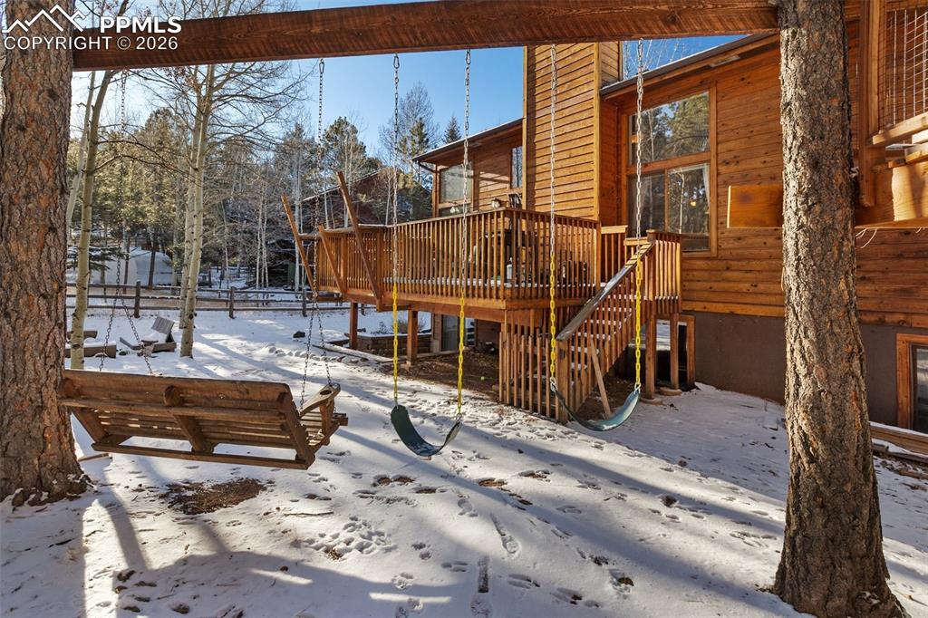 747 Pinon Ridge Drive Woodland Park, CO 80863 - Photo 29 of 32 a view of a house with a snow on the road