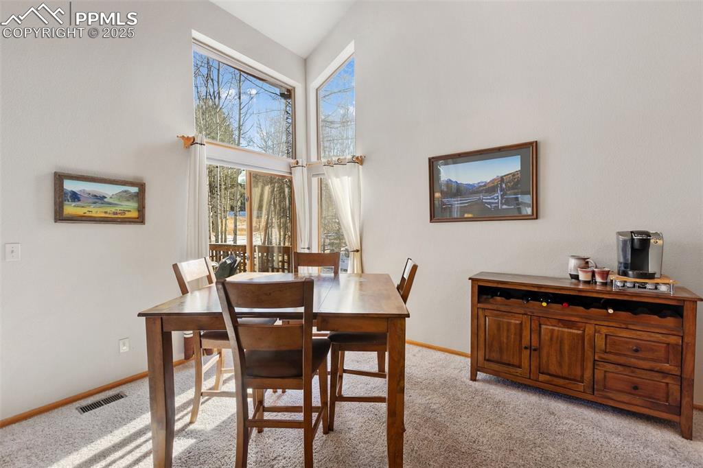 747 Pinon Ridge Drive Woodland Park, CO 80863 - Photo 5 of 32 a dining room with furniture and window