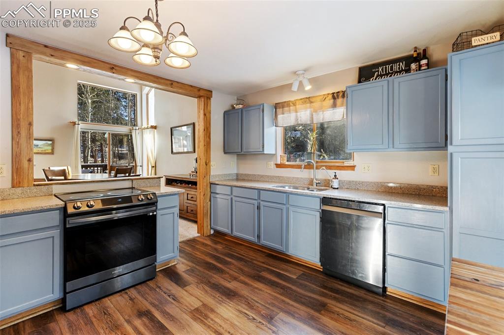 747 Pinon Ridge Drive Woodland Park, CO 80863 - Photo 8 of 32 a kitchen with a stove a sink and a refrigerator