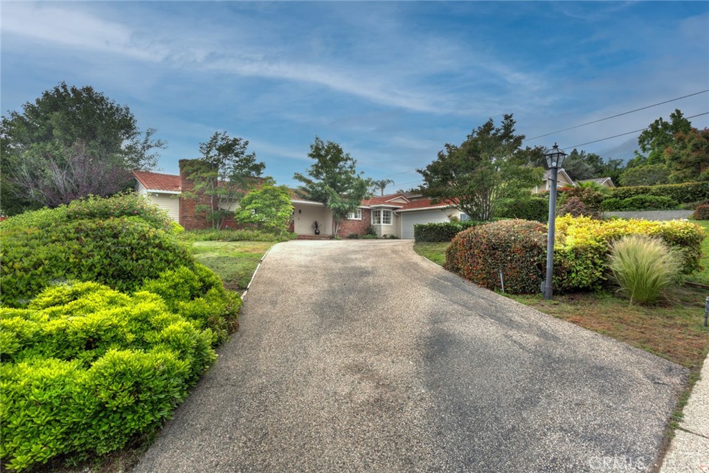 5211 Ocean View Boulevard La Canada Flintridge, CA 91011 - Photo 3 of 45 a house with green field in front of it