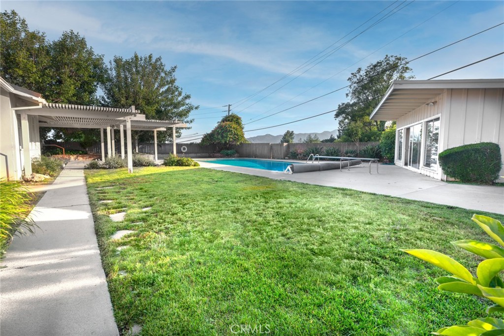 5211 Ocean View Boulevard La Canada Flintridge, CA 91011 - Photo 40 of 45 a front view of a house with a yard and potted plants