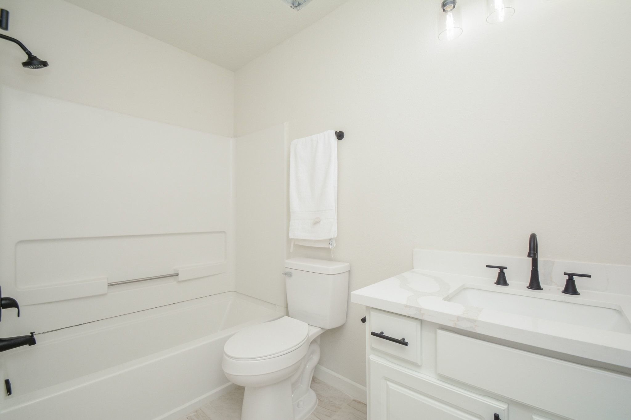 4903 South Lazy Ridge Drive Houston, TX 77053 - Photo 17 of 29 a bathroom with a sink a toilet and shower
