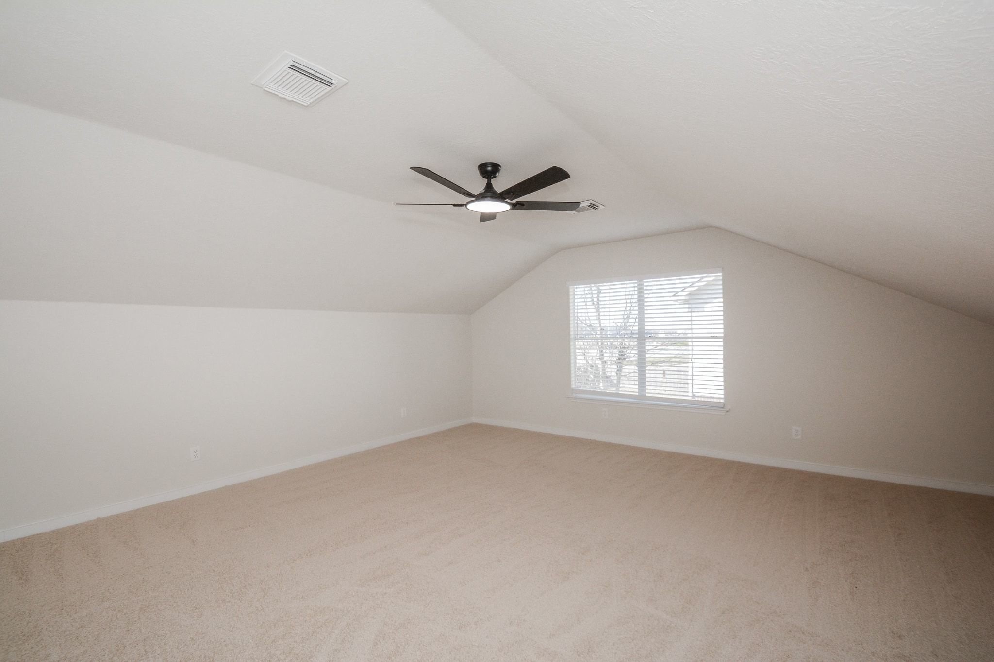 4903 South Lazy Ridge Drive Houston, TX 77053 - Photo 21 of 29 an empty room with a window and a ceiling fan