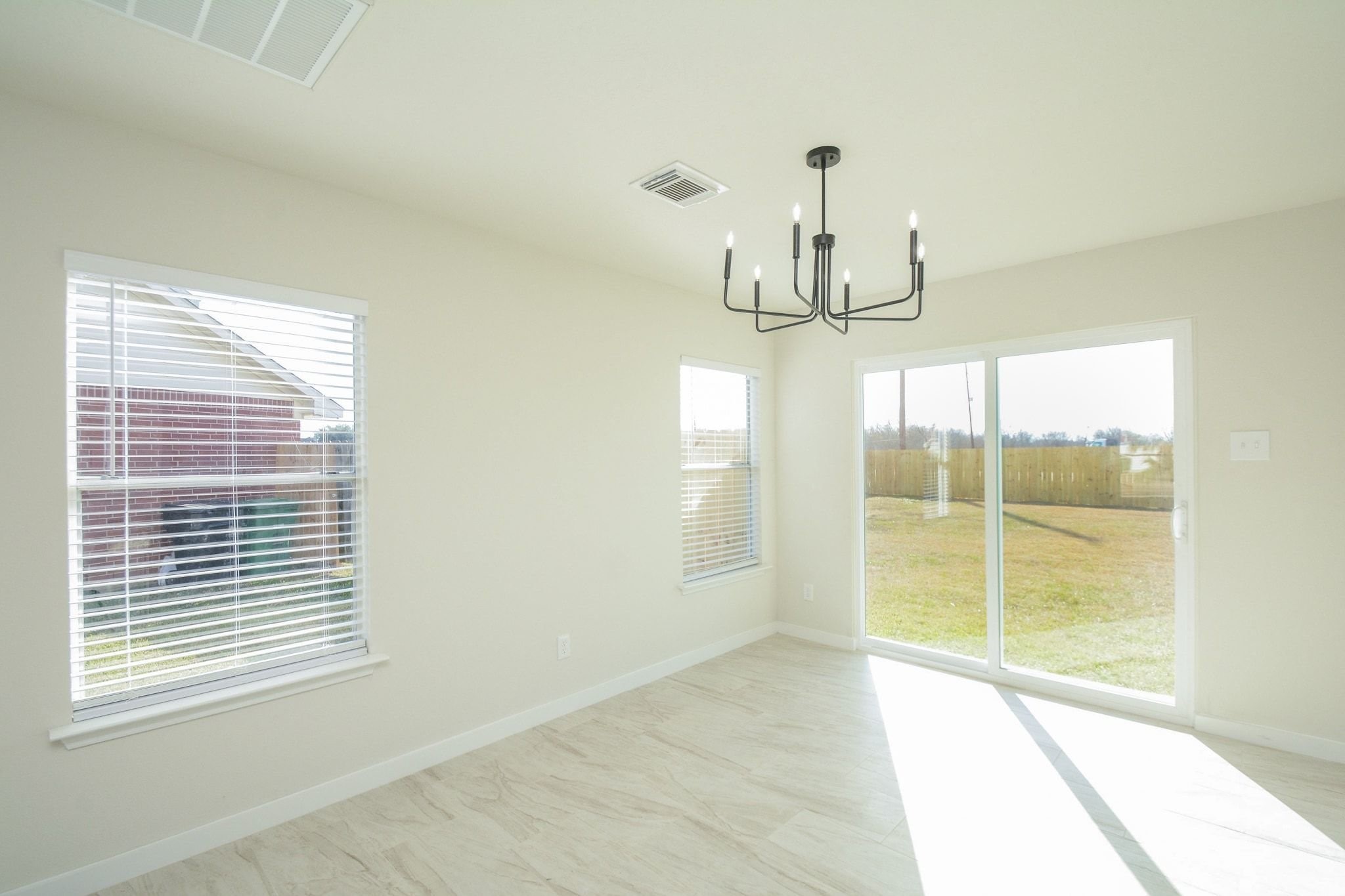 4903 South Lazy Ridge Drive Houston, TX 77053 - Photo 6 of 29 a view of empty room with wooden floor and fan