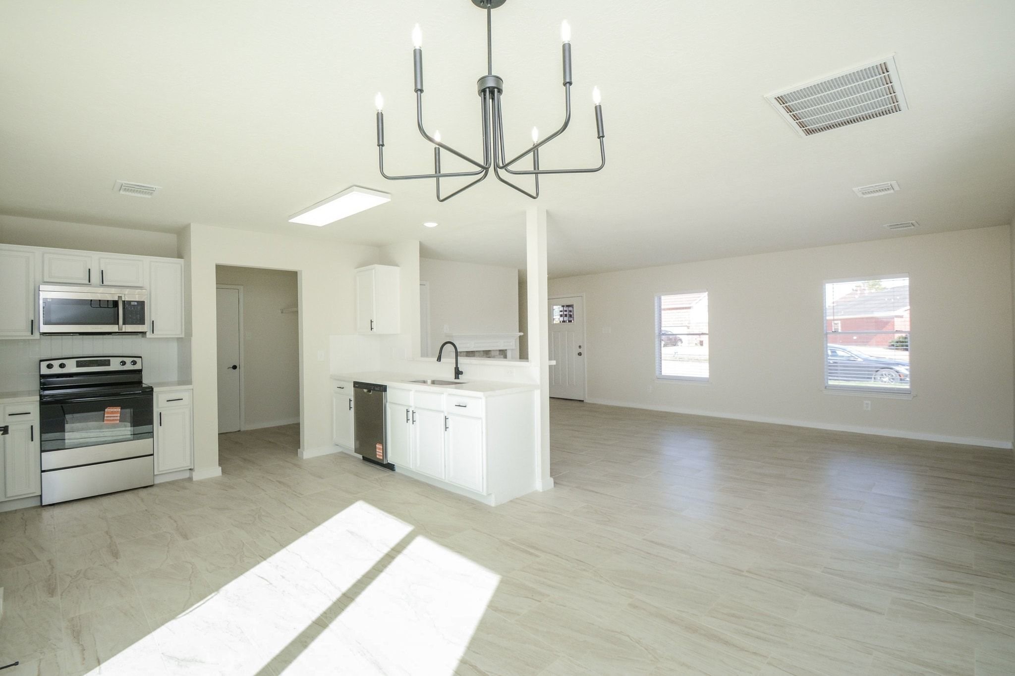 4903 South Lazy Ridge Drive Houston, TX 77053 - Photo 7 of 29 a view of a kitchen with a sink cabinets and a window