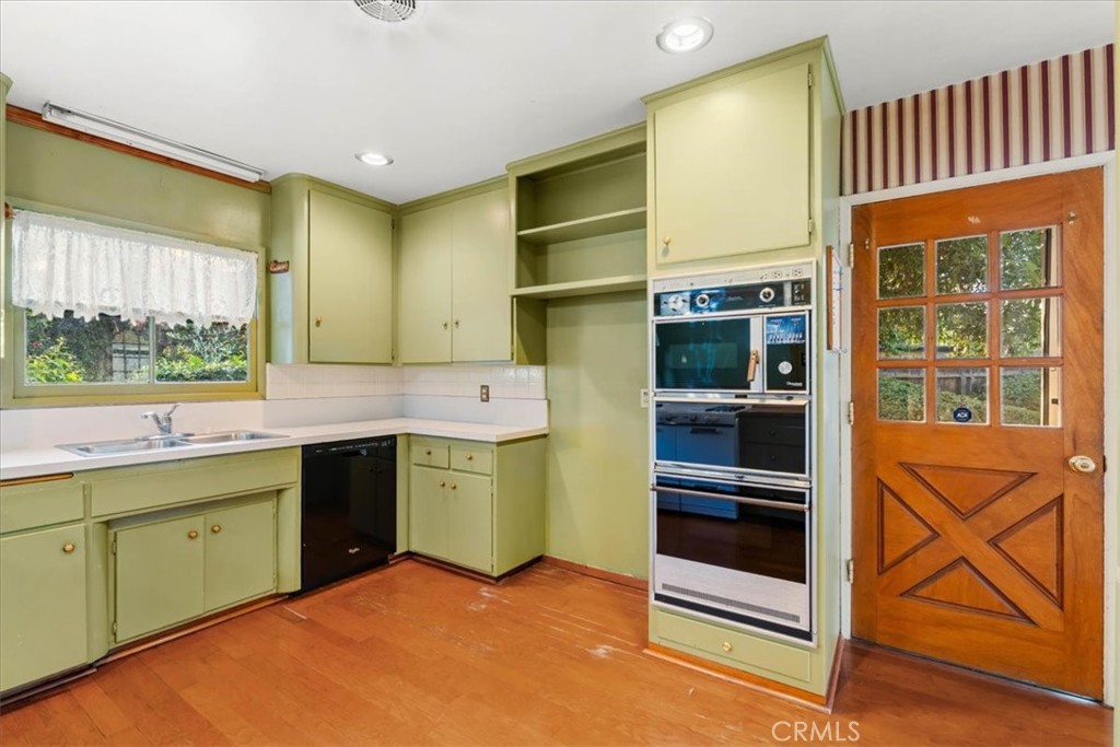 2807 Wyoming Way Riverside, CA 92506 - Photo 13 of 40 a kitchen with a refrigerator and a sink