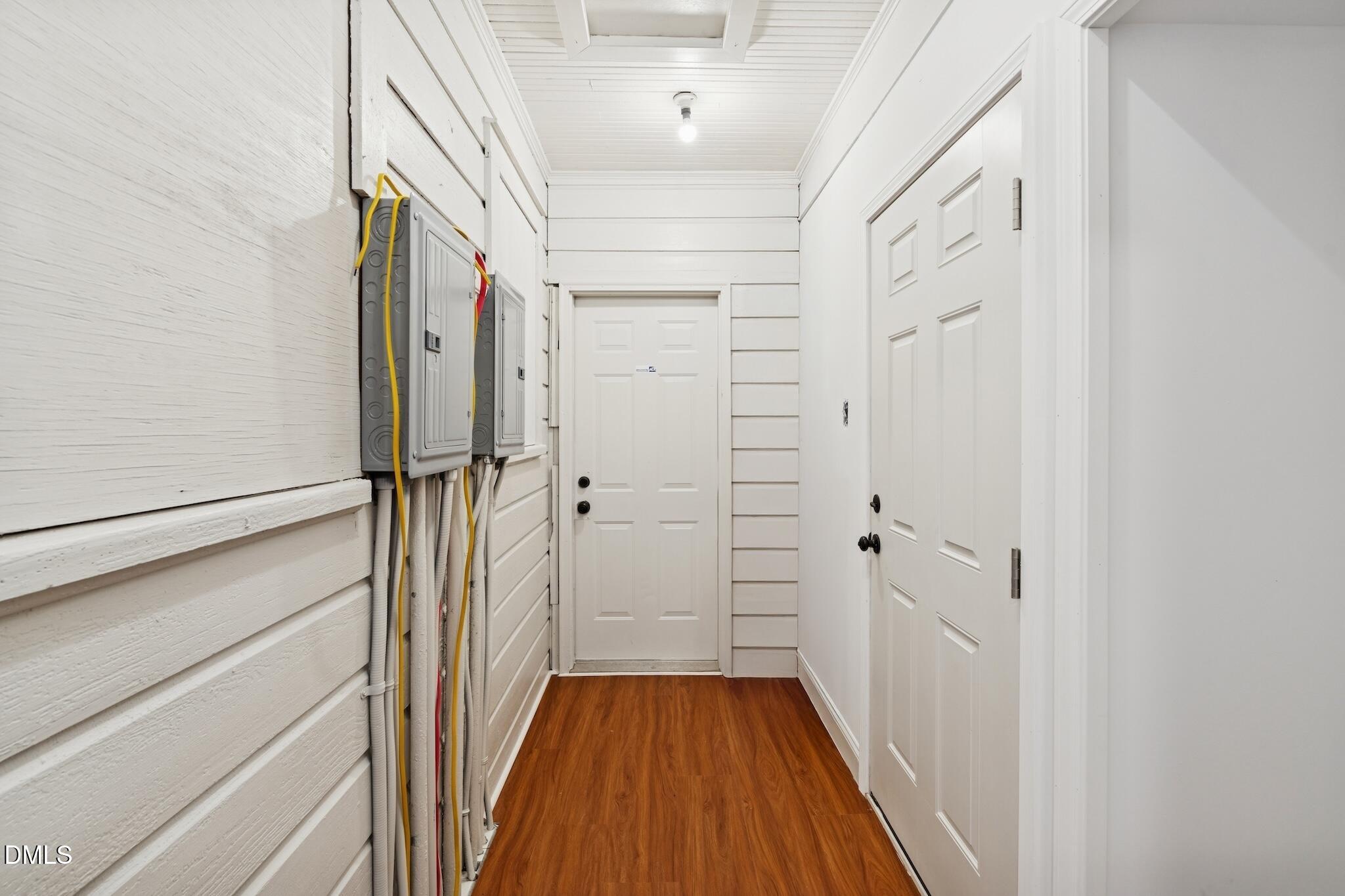 705 North Driver Street Durham, NC 27703 - Photo 21 of 46 a view of a hallway with wooden floor and staircase