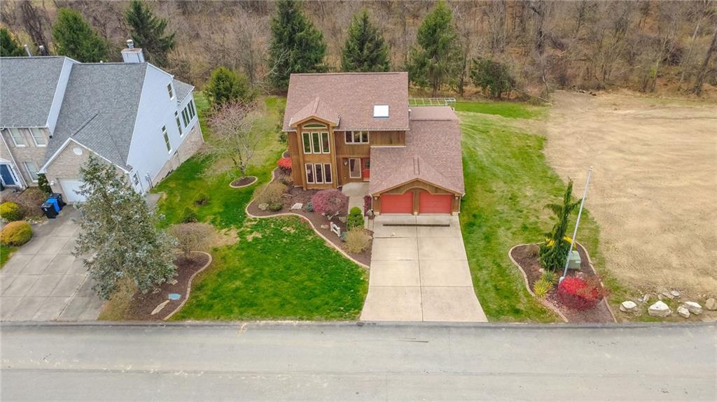 506 Princess Drive Elizabeth, PA 15037 - Photo 4 of 46 an aerial view of a house with a garden and pathway
