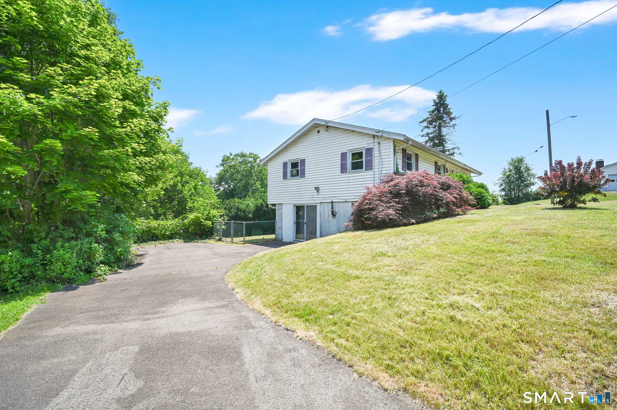 7 Rogers Drive Meriden, CT 06450 - Photo 2 of 40 a front view of a house with a yard and garage