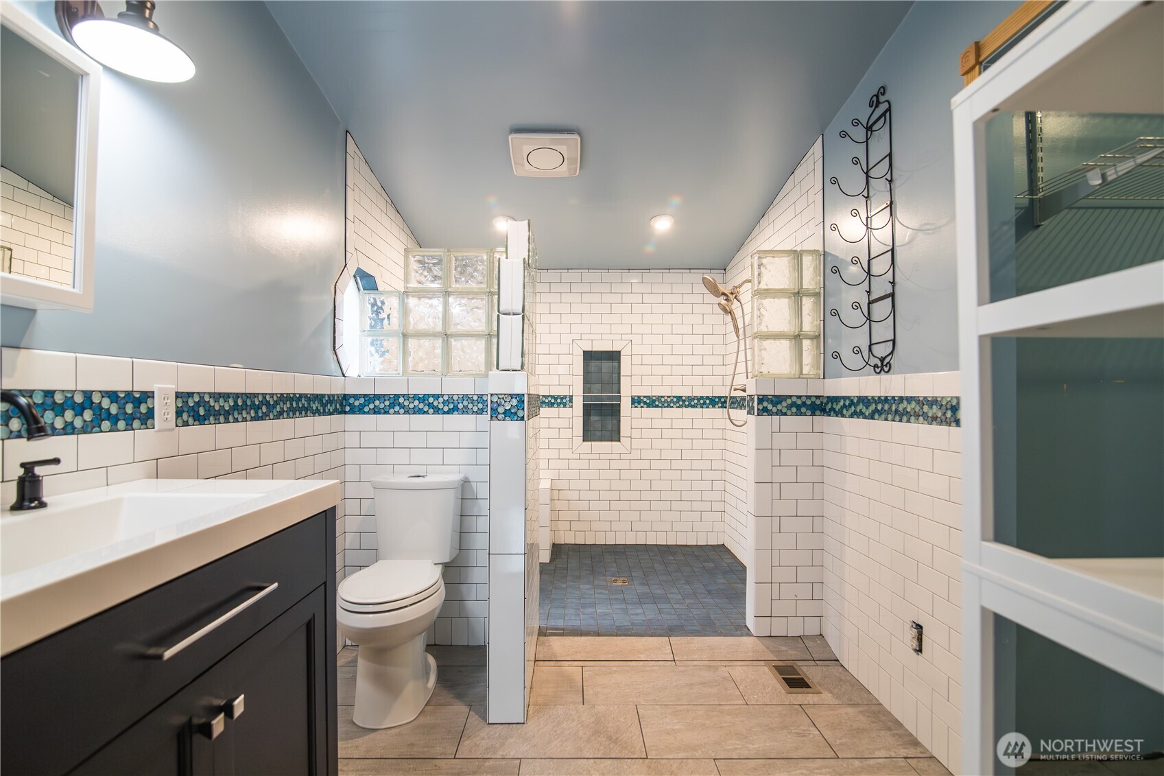 510 Duterrow Road Southeast, Unit 22 Lacey, WA 98513 - Photo 19 of 27 a bathroom with a sink a toilet and mirror