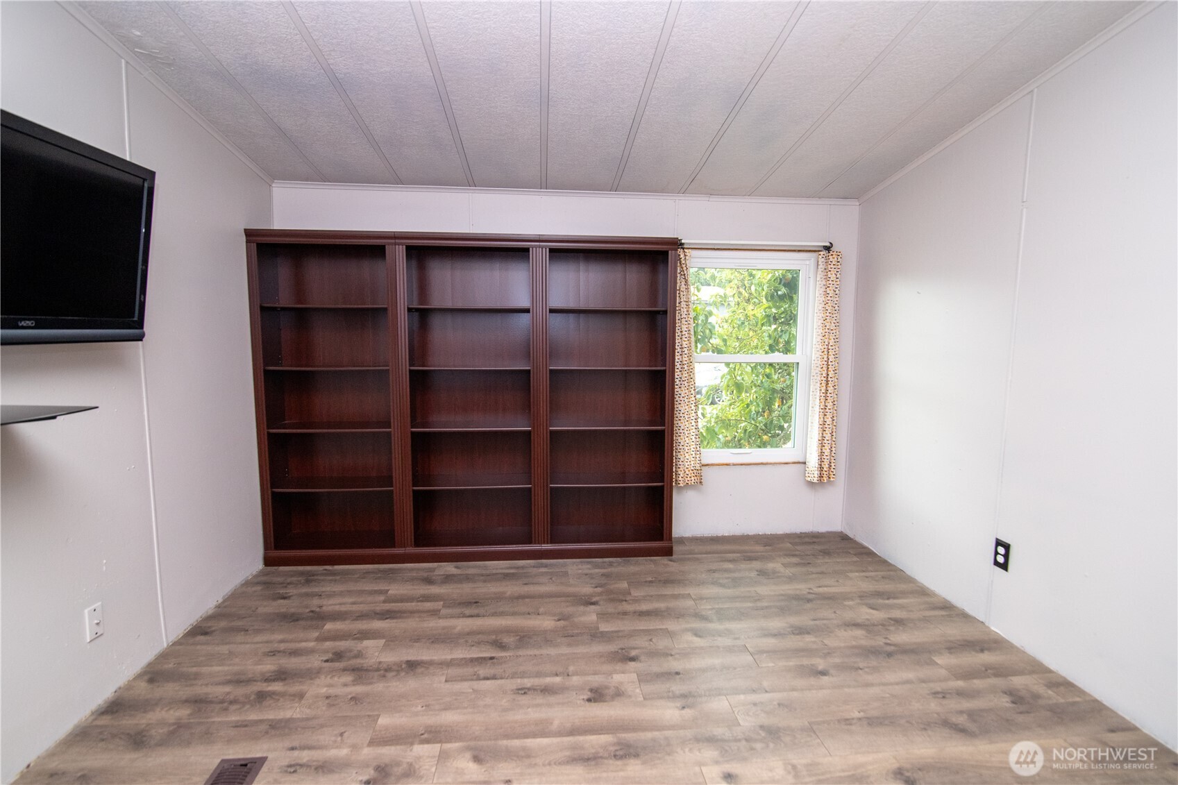 510 Duterrow Road Southeast, Unit 22 Lacey, WA 98513 - Photo 23 of 27 a view of wooden floor and cabinet in a room