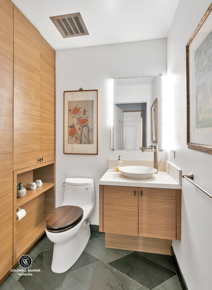 1148 5th Avenue, Unit PARLOR/A Manhattan, NY 10128 - Photo 14 of 20 a bathroom with a toilet sink and mirror