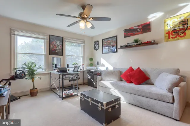 a bedroom with furniture and a window