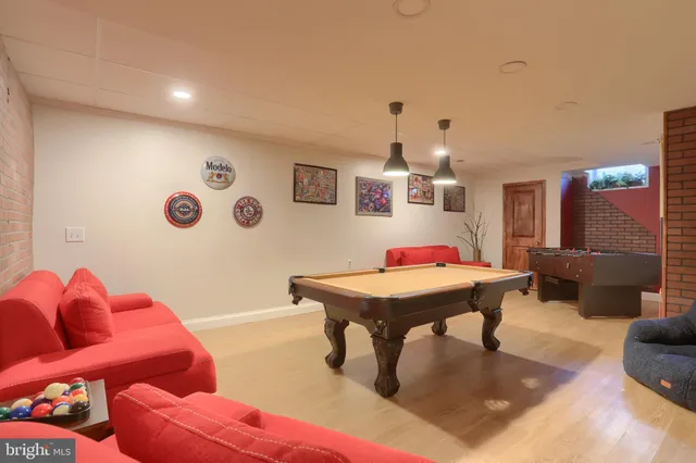 a view of a house with a yard and potted plants