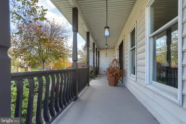 a view of a porch with wooden floor and stairs