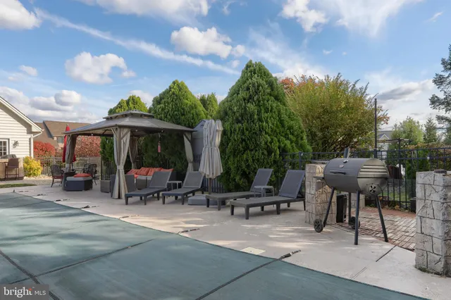 a view of a patio with a table and chairs