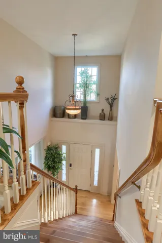 a view of a hallway with furniture and entryway