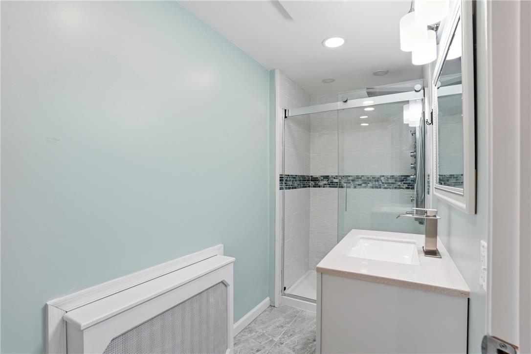 6271 Batman Road Zionsville, PA 18092 - Photo 56 of 100 A well-appointed bathroom features a glass-enclosed shower and a sleek vanity with modern fixtures.