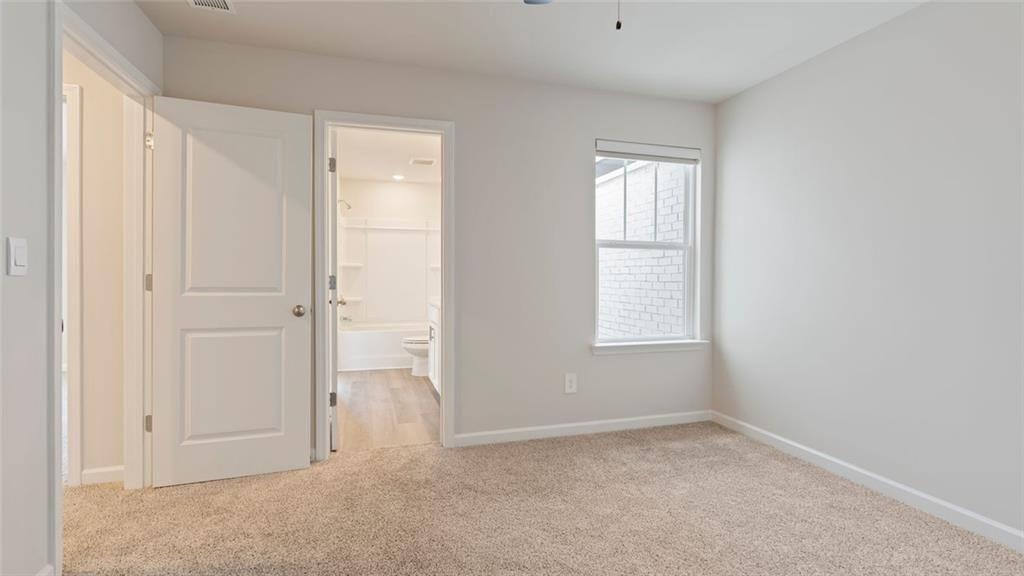 1629 Flint River Place Southeast Smyrna, GA 30126 - Photo 14 of 27 an empty room with windows and closet