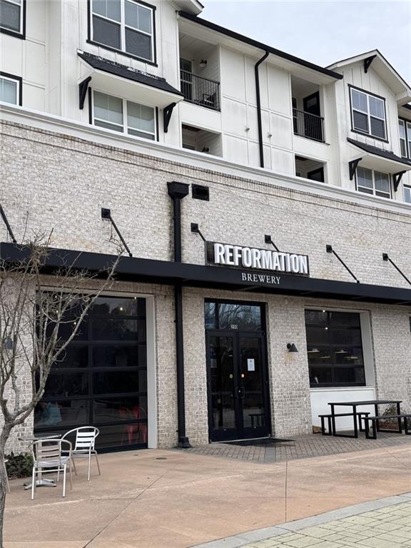 1629 Flint River Place Southeast Smyrna, GA 30126 - Photo 26 of 27 a view of a building with a window and a car park in front of it