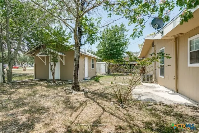 a house with trees in front of it