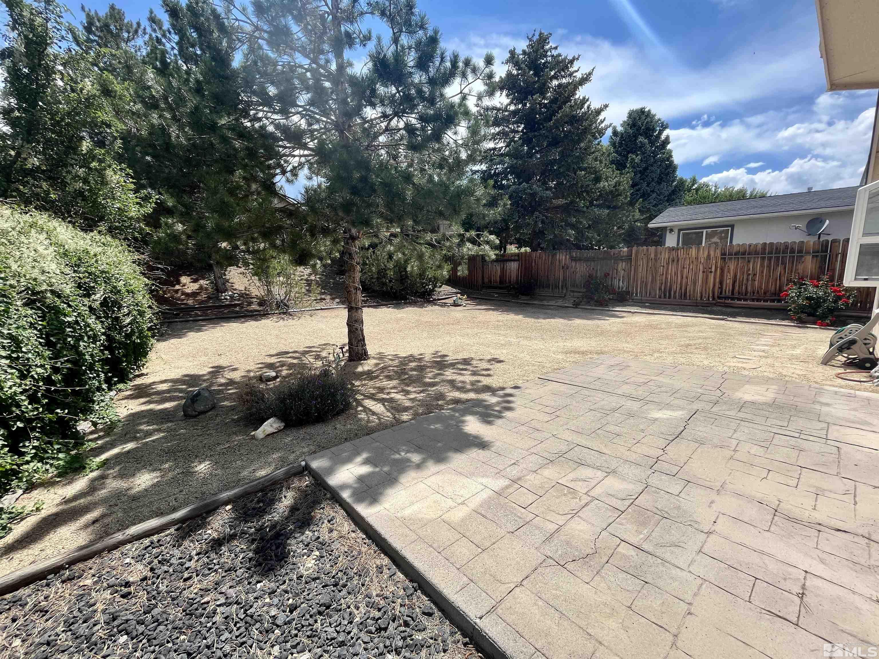 6310 Park Place Reno, NV 89523 - Photo 18 of 22 a view of a house with backyard and trees