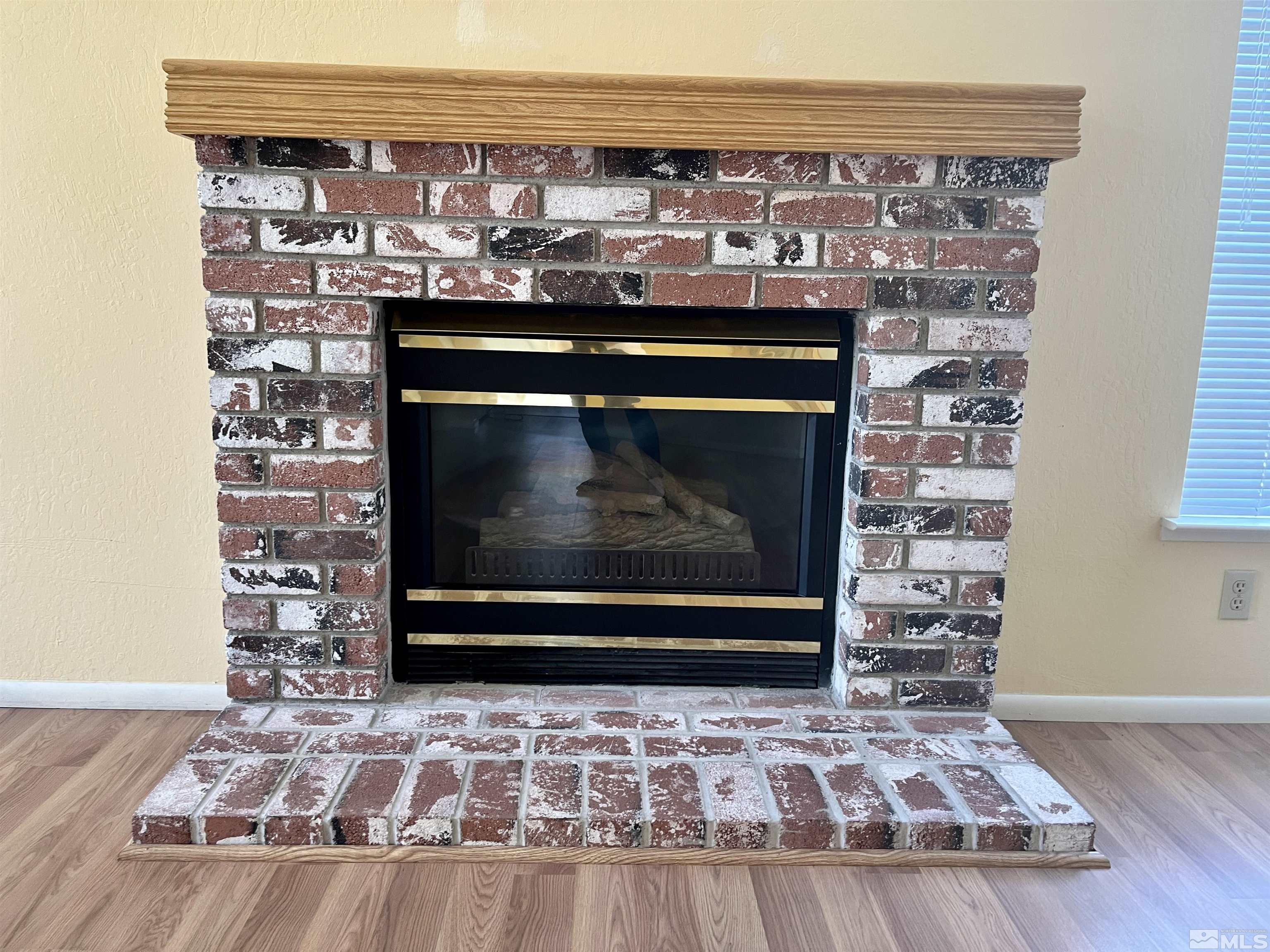 6310 Park Place Reno, NV 89523 - Photo 4 of 22 a fireplace with a clock on top of it
