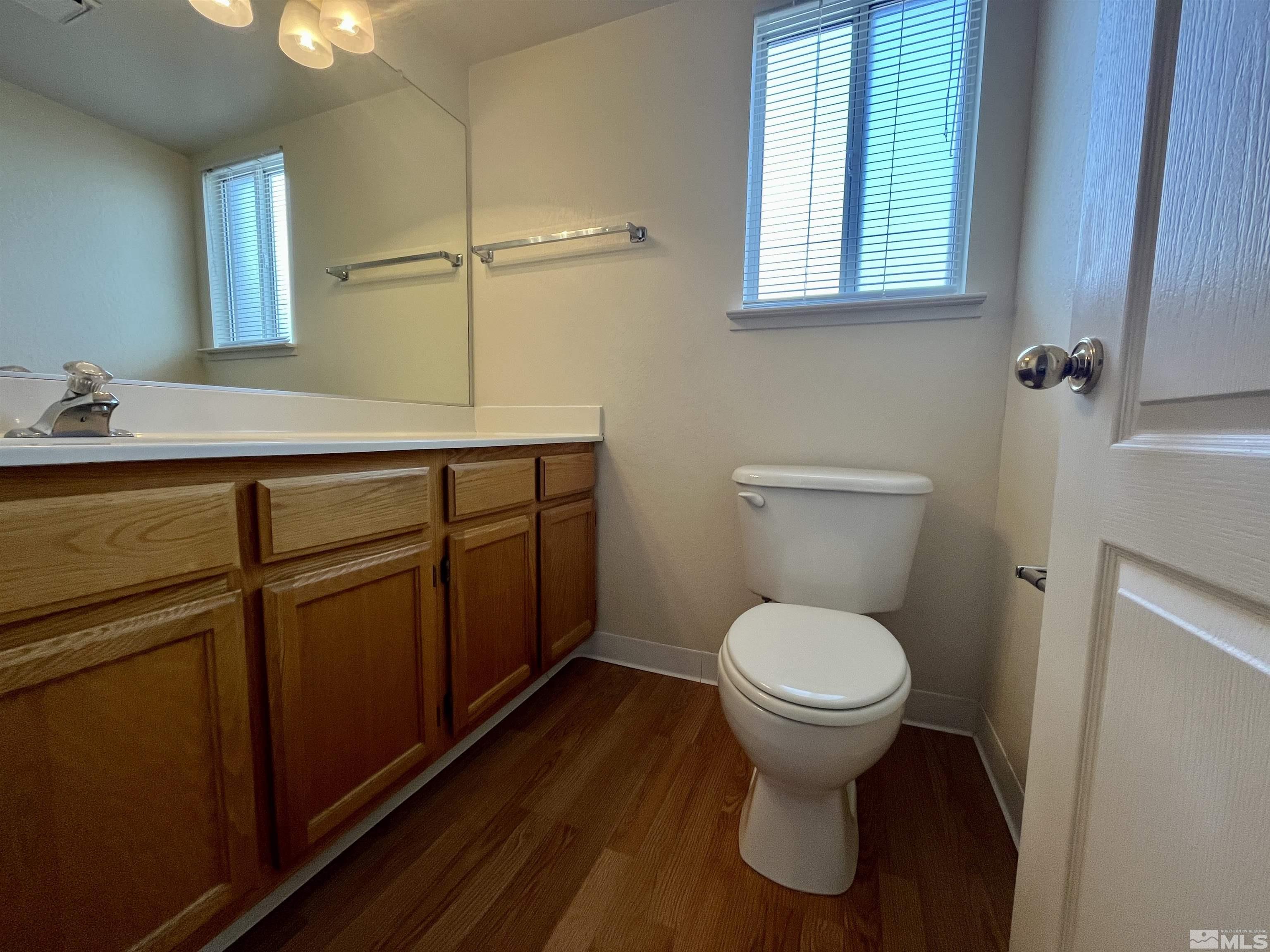 6310 Park Place Reno, NV 89523 - Photo 10 of 22 a bathroom with a toilet sink and mirror