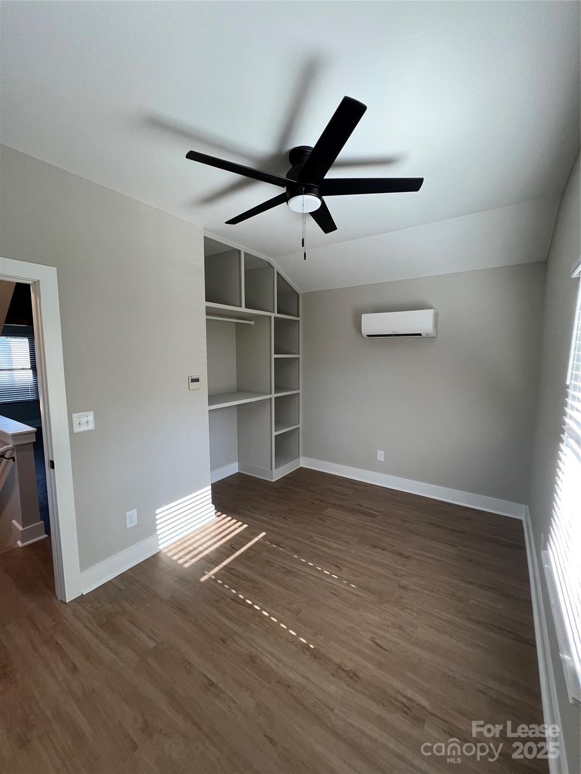 402 North 4th Street Albemarle, NC 28001 - Photo 11 of 19 a view of an empty room with wooden floor and a window