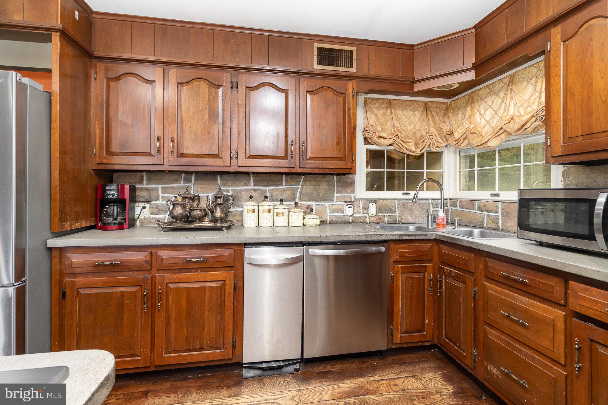 1554 Williams Grove Road Dillsburg, PA 17019 - Photo 16 of 75 a kitchen with stainless steel appliances granite countertop a sink and cabinets