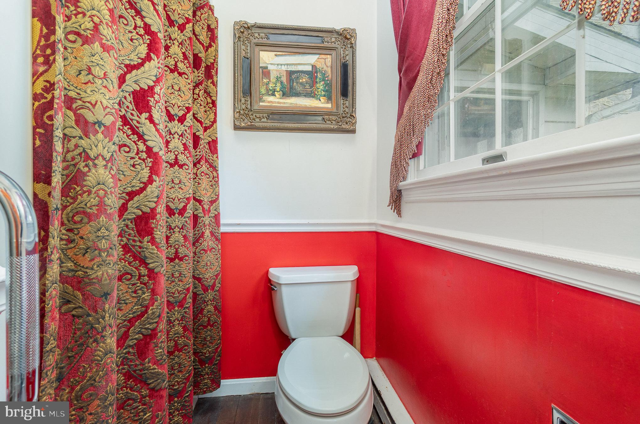 1554 Williams Grove Road Dillsburg, PA 17019 - Photo 24 of 75 a bathroom with a toilet and a shower curtain