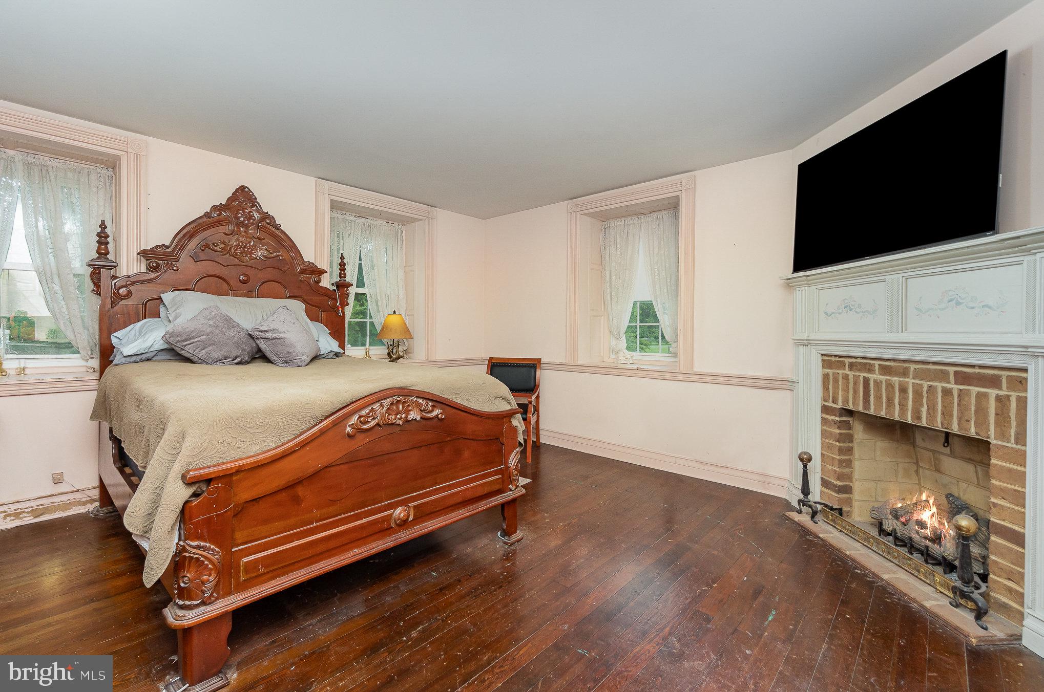 1554 Williams Grove Road Dillsburg, PA 17019 - Photo 27 of 75 a bedroom with a bed and a flat screen tv