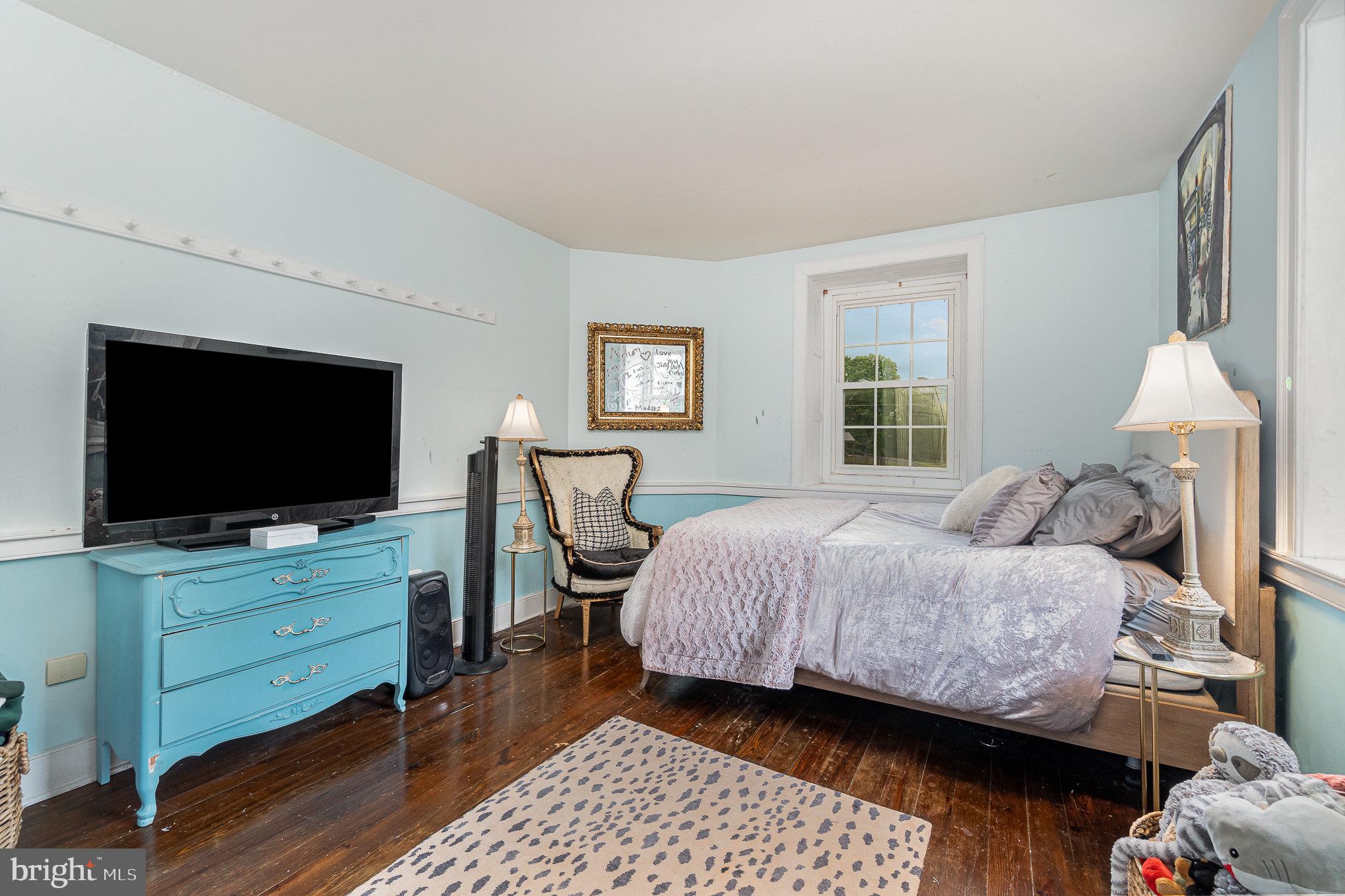 1554 Williams Grove Road Dillsburg, PA 17019 - Photo 30 of 75 a bedroom with a bed and a flat screen tv