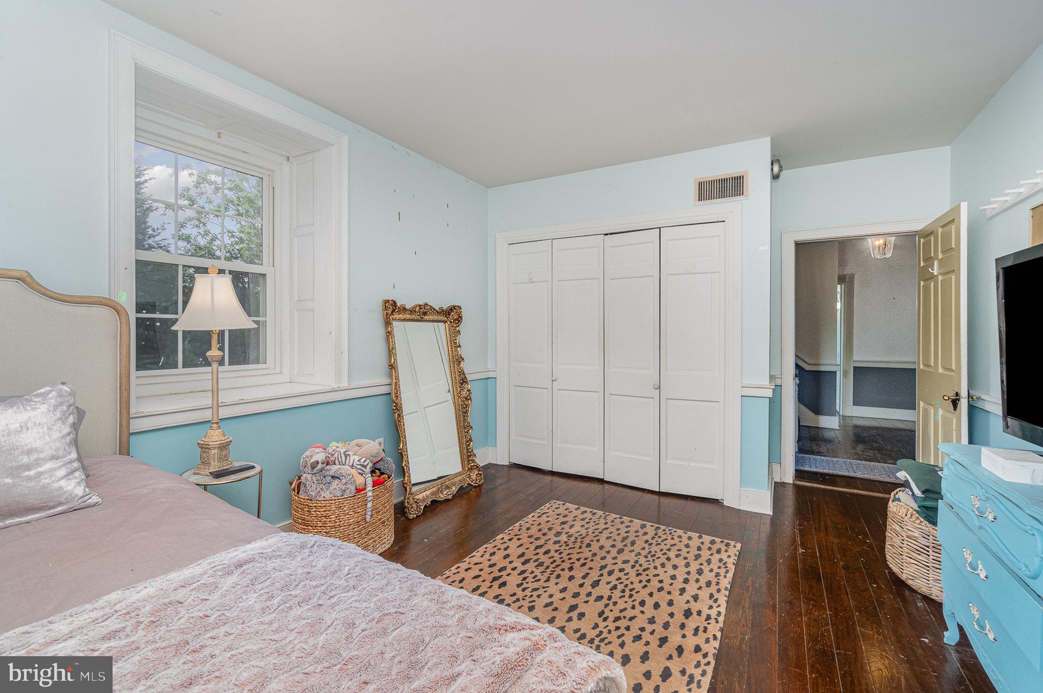 1554 Williams Grove Road Dillsburg, PA 17019 - Photo 31 of 75 a bedroom with a bed and wooden floor