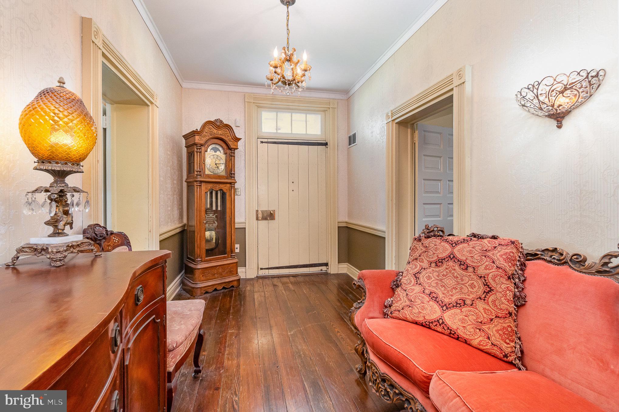 1554 Williams Grove Road Dillsburg, PA 17019 - Photo 8 of 75 a bedroom with bed and a chandelier