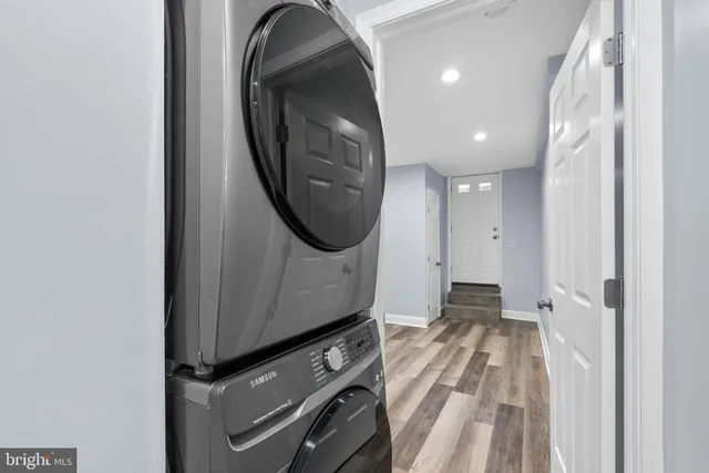 a view of a hallway with washer and dryer