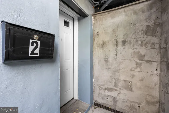 a bathroom with a shower and a door