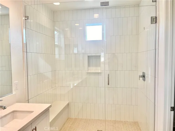 a bathroom with a bathtub and a sink