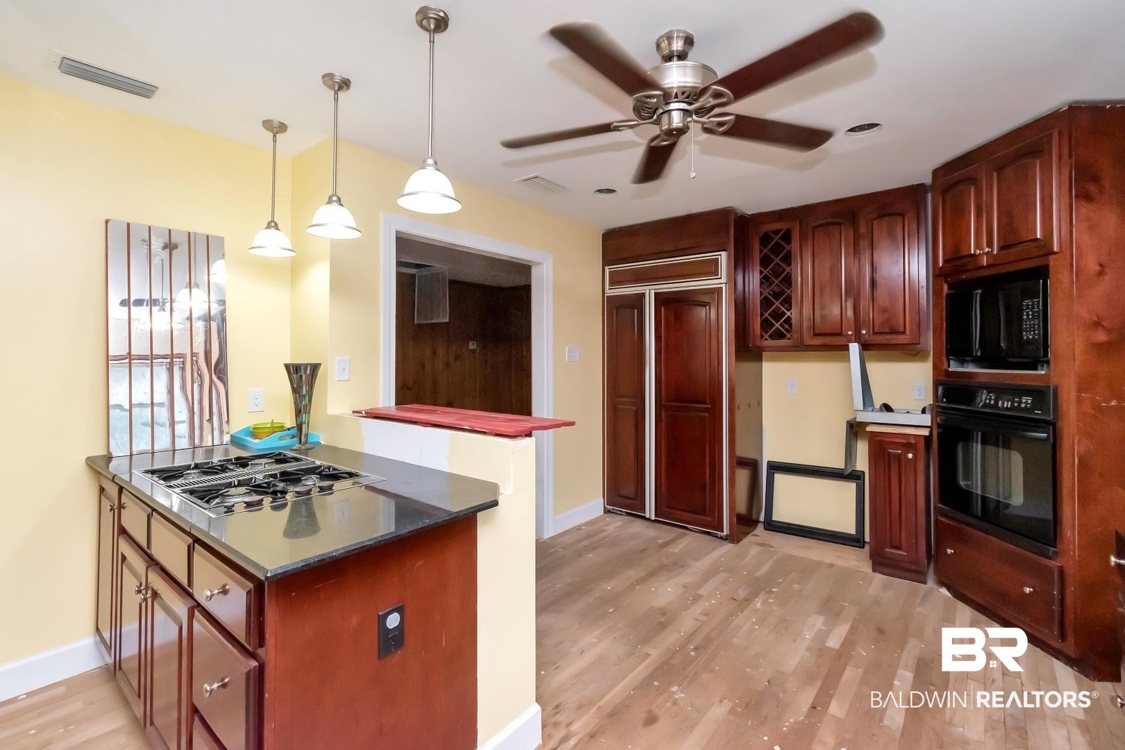 2762 Hillcrest Road Mobile, AL 36695 - Photo 13 of 25 Kitchen featuring pendant lighting, light wood-type flooring, black appliances, and ceiling fan